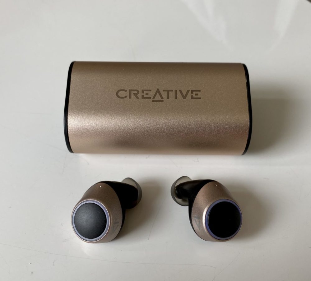 outlier gold headphones and case